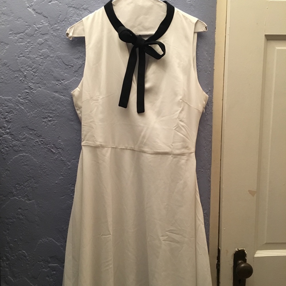 White skater dress with black tie front